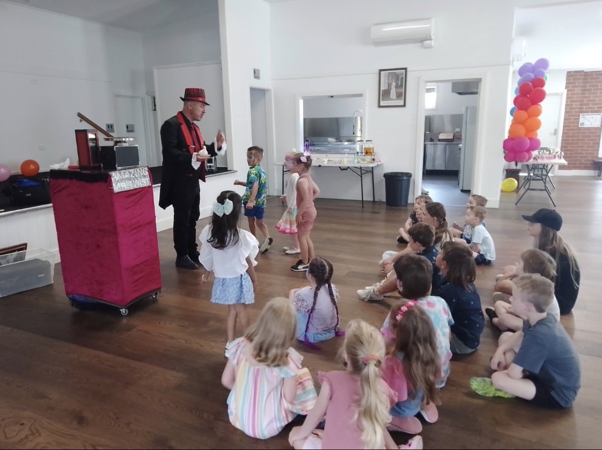 Amazing Mr Twist performing magic for kids at a birthday party